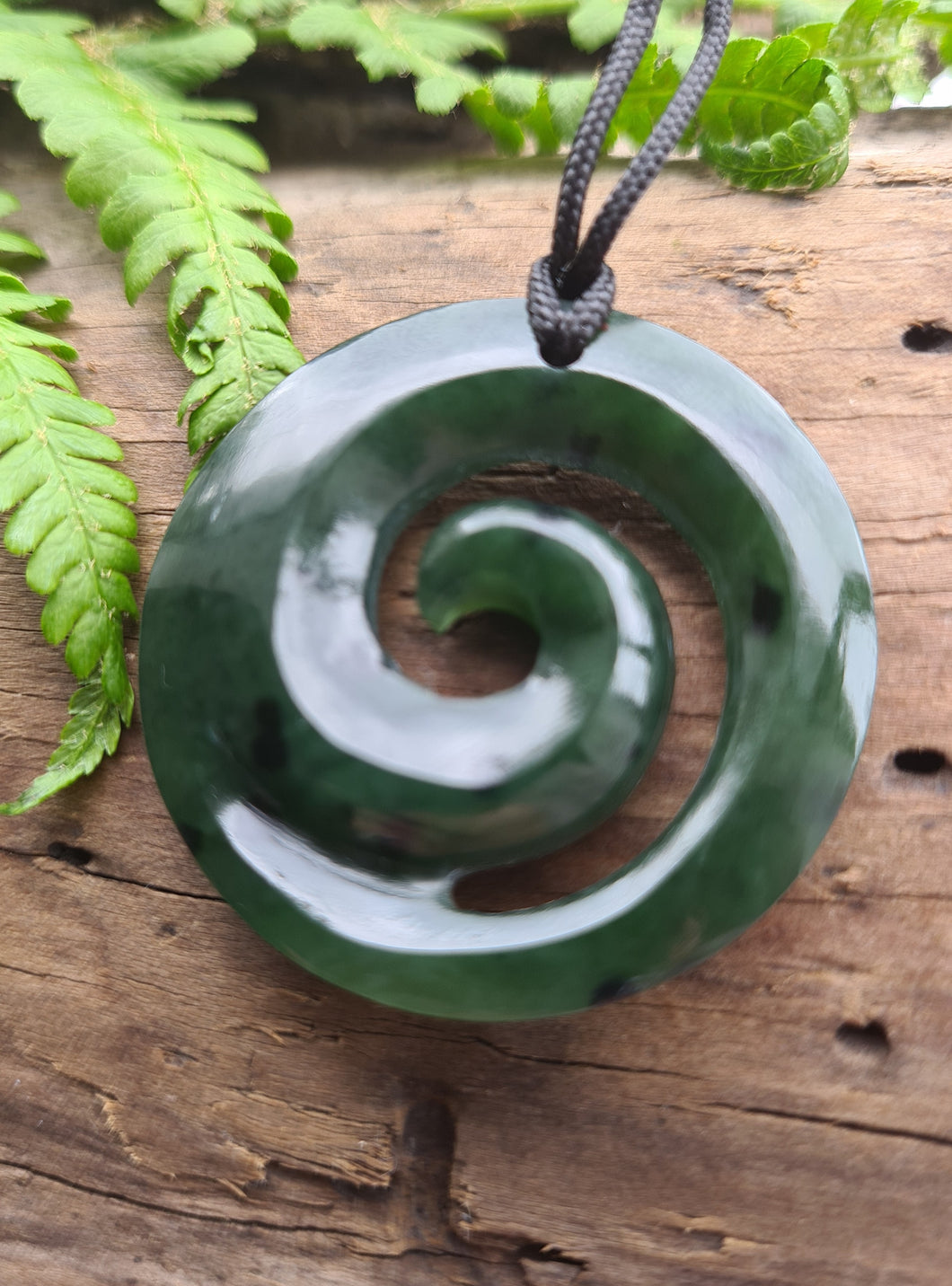 Koru NZ greenstone hand carved pendant.  Symbolises new life, growth, strength